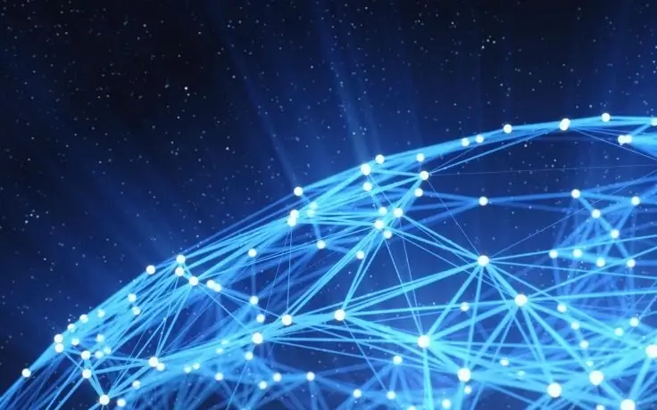 A close-up of a blue glowing network of connected lines and points, resembling a digital sphere, against a starry background.