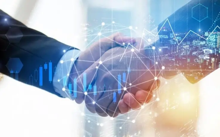 A handshake overlayed by a digital data chart with a network web.