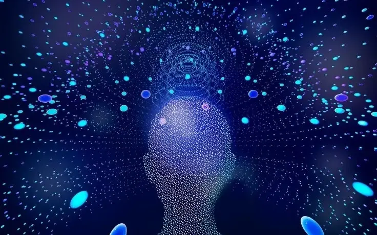 A digital silhouette of a human head formed by glowing dots surrounded by floating blue particles and light circles.