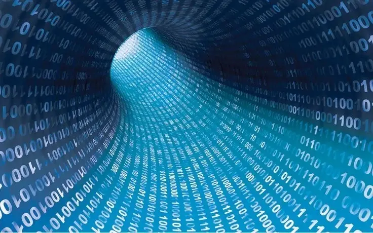 A blue digital tunnel formed by vertical columns of white and light blue binary code numbers 1 and 0.