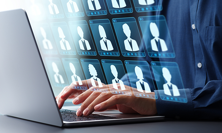Icons of people in front of a laptop